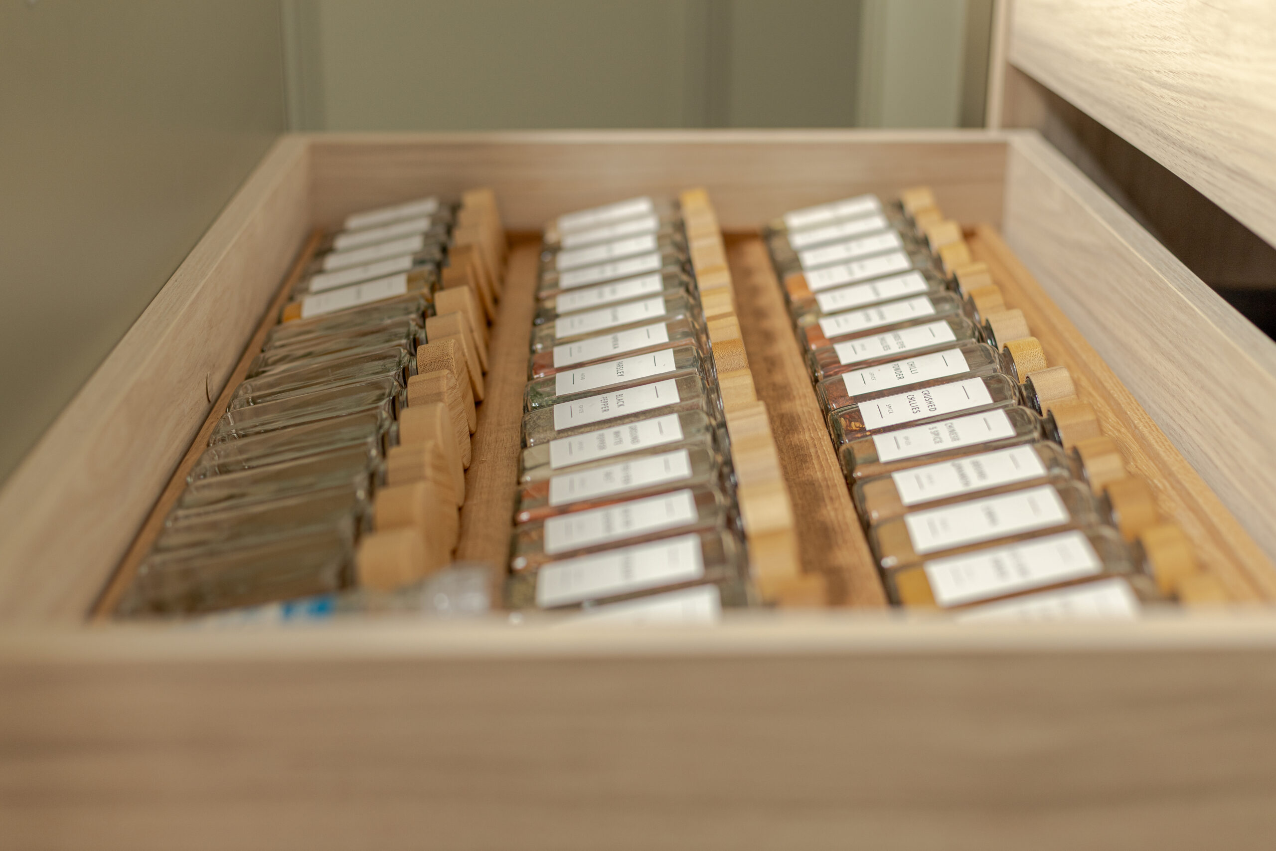 A refined modern classic kitchen combining timeless shaker cabinetry with contemporary finishes and natural warmth.